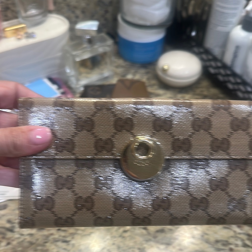 Gucci Tan Monogram Clutch with Gold Accent